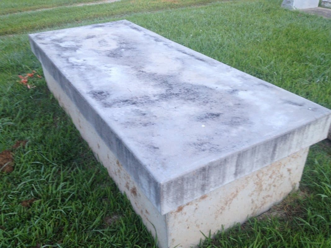 After: A concrete vault after texture coating, finished in a mottled, stone-like gray.