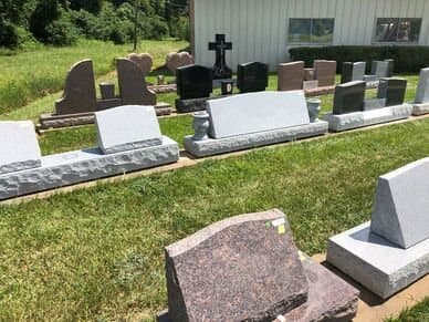 Headstone samples on display outside the Alexandria shop.